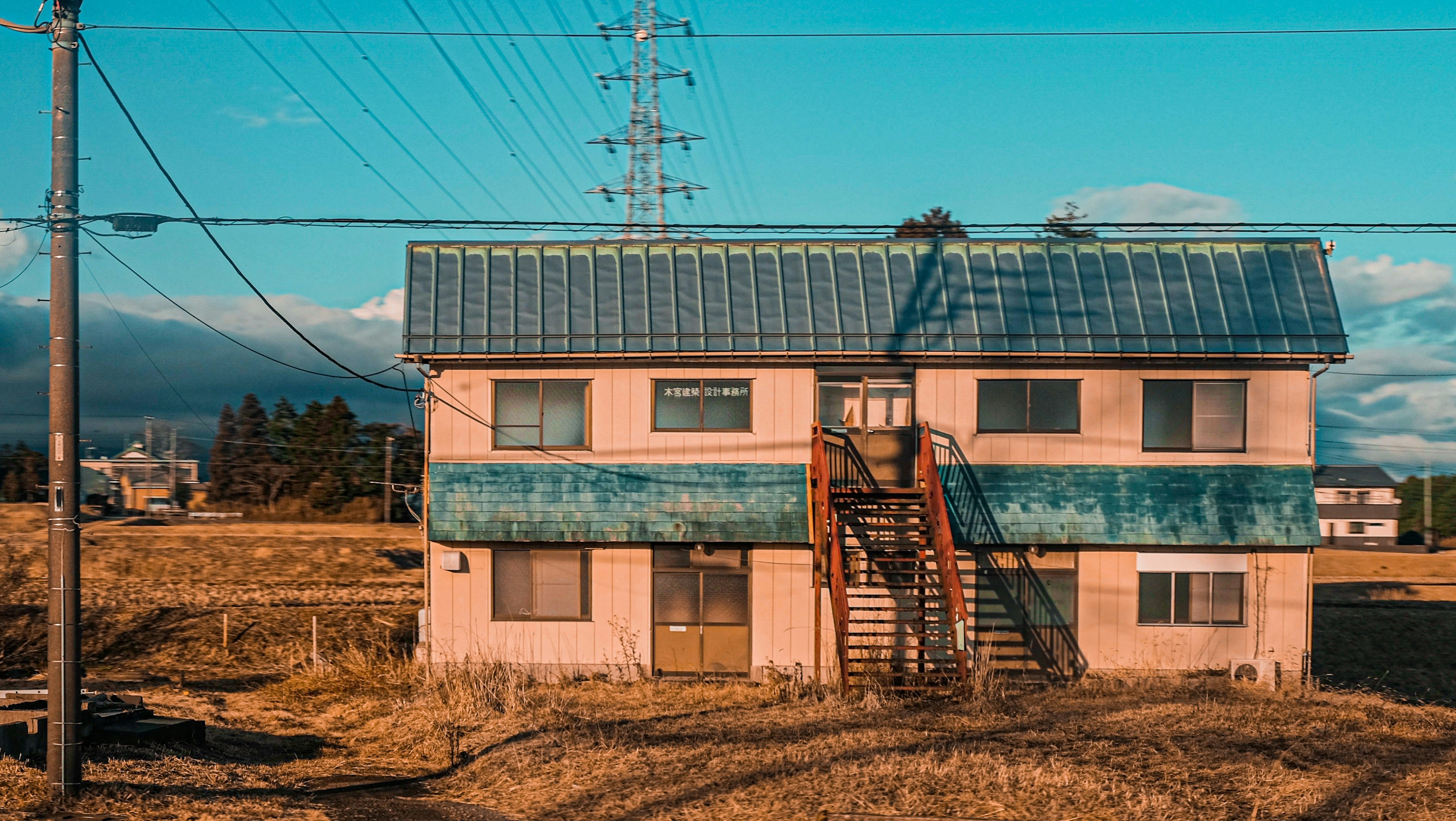 brown and blue concrete building under blue sky during daytime