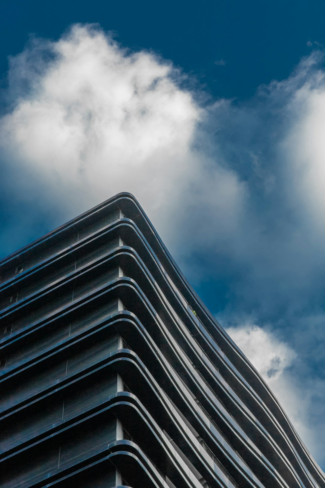 black and white striped building under blue sky