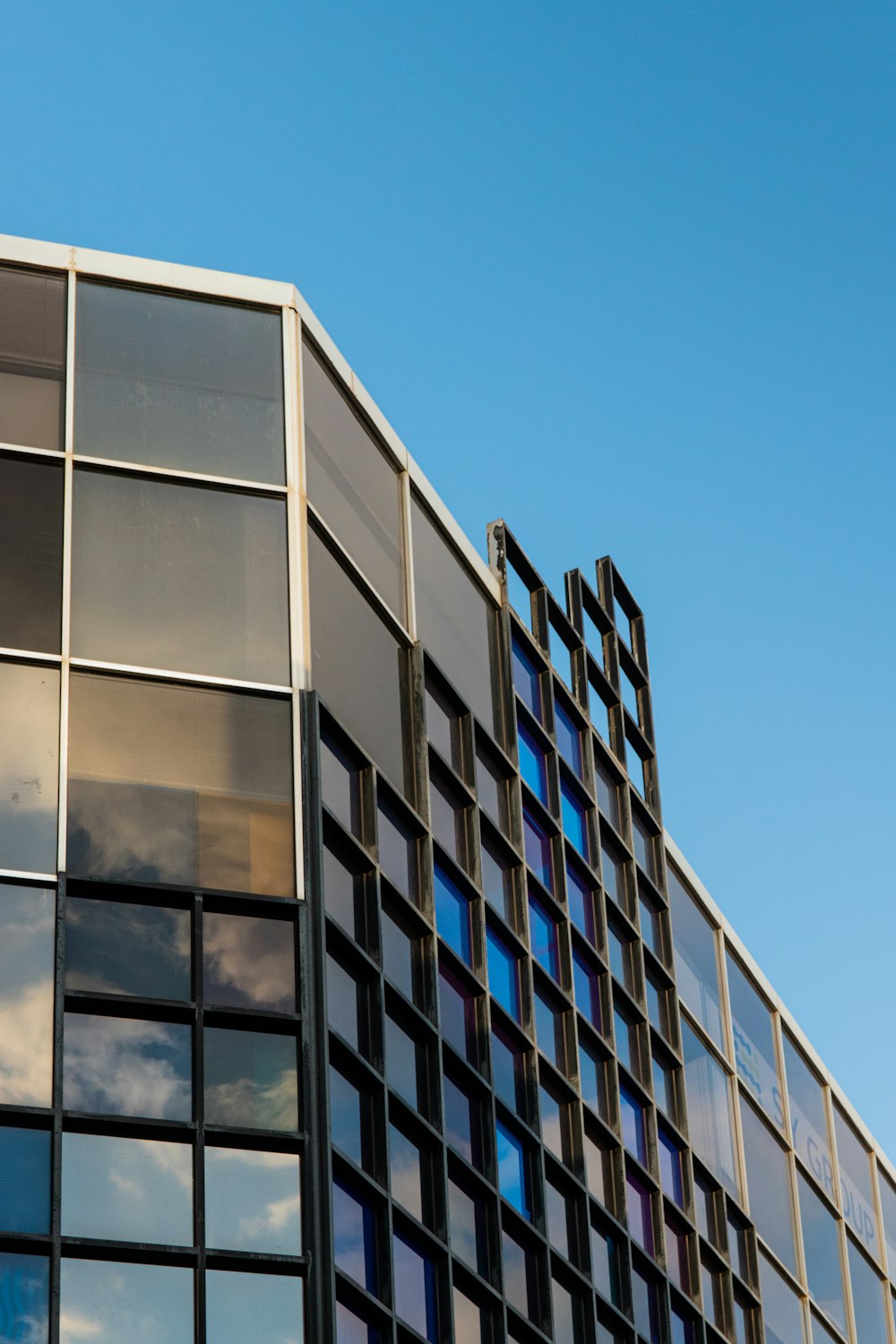 white and blue concrete building under blue sky during daytime