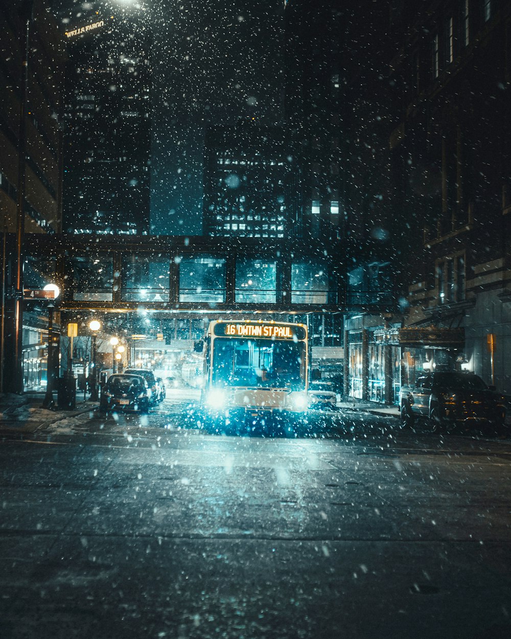 white bus on road during night time