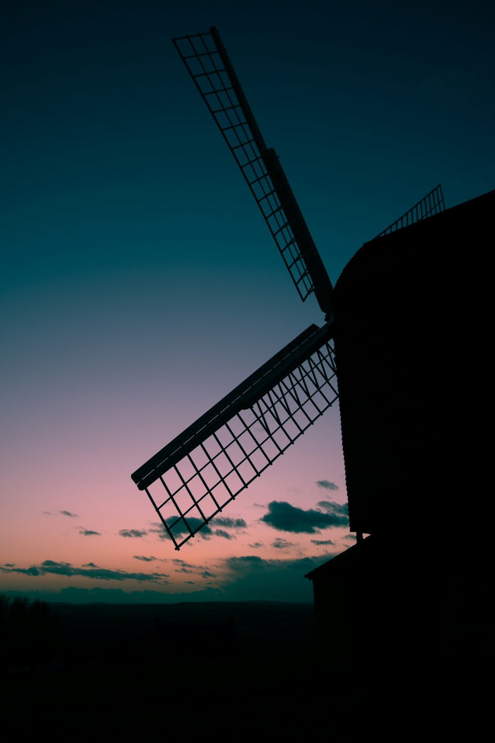 silhouette of building during sunset