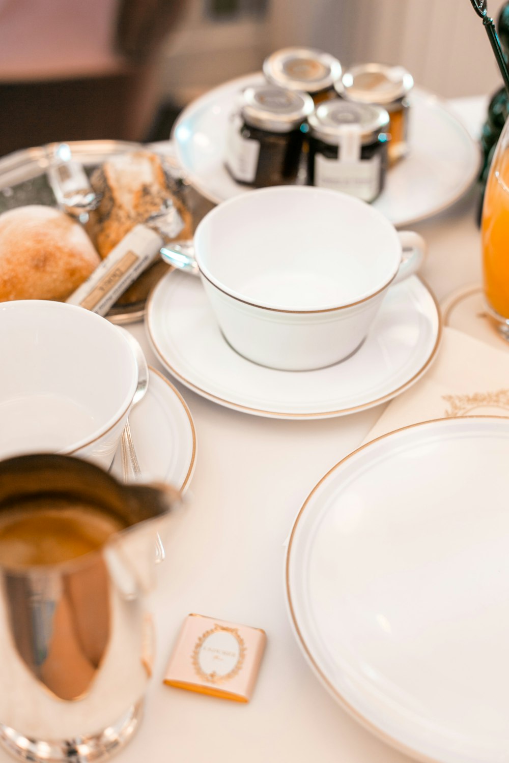 white ceramic teacup on saucer