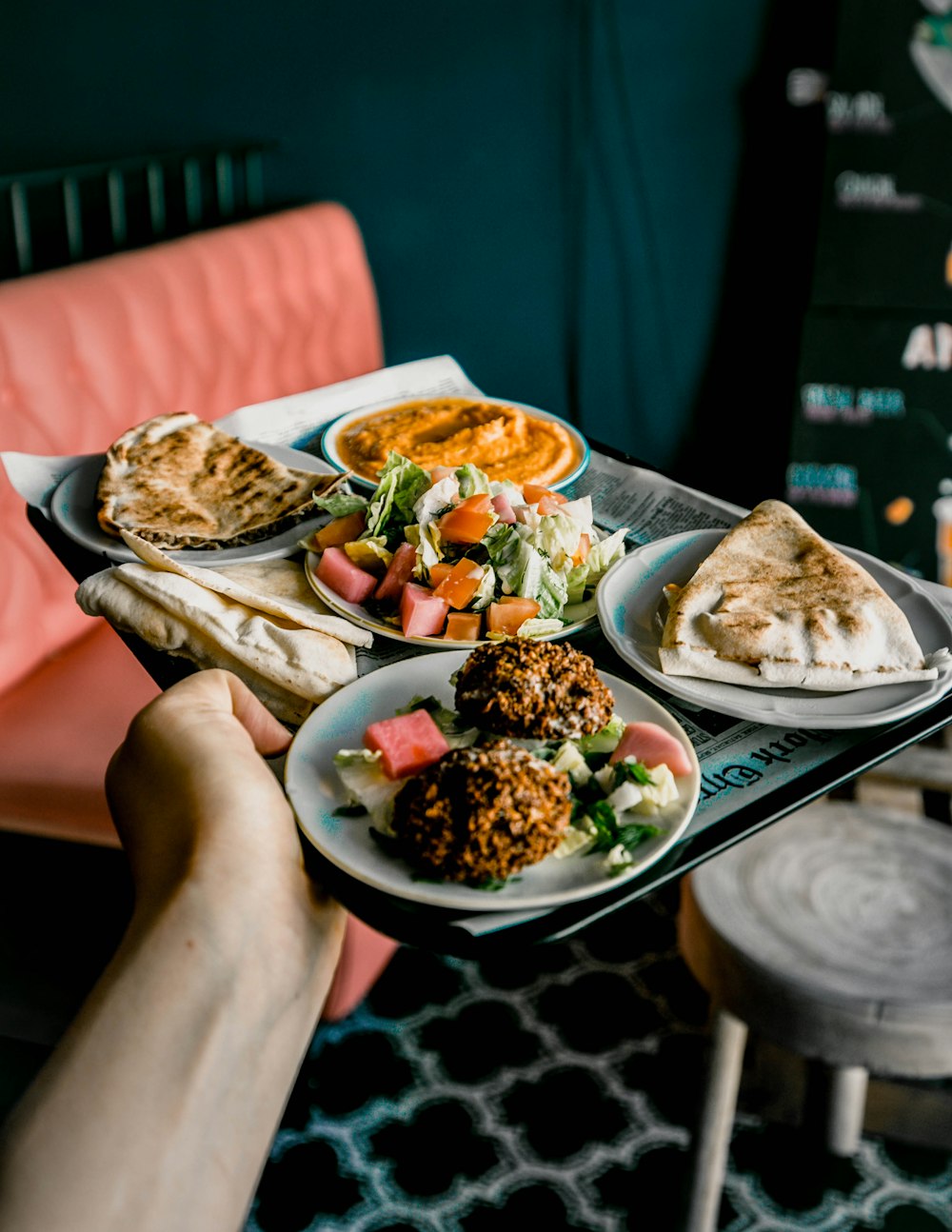 person holding white ceramic plate with food