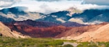 brown and gray mountains under white sky during daytime