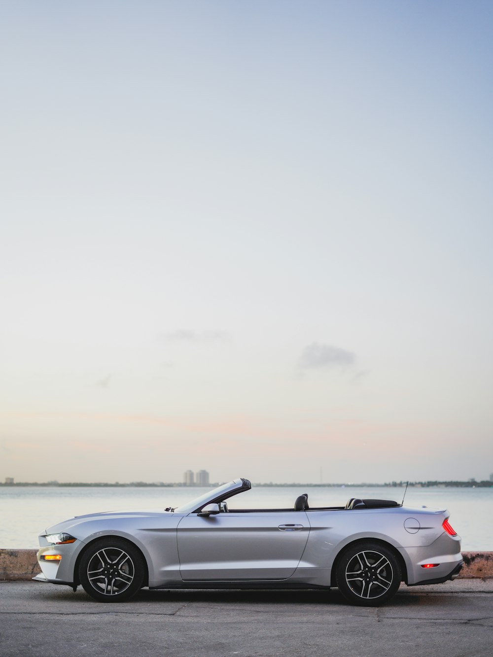 grey convertible car on beach during daytime