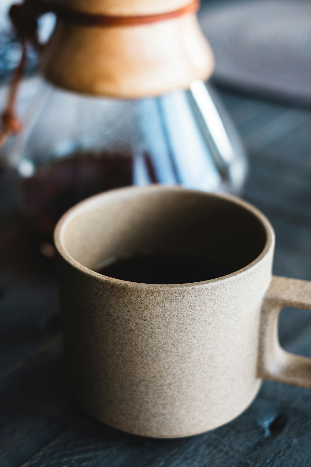 white ceramic mug on table