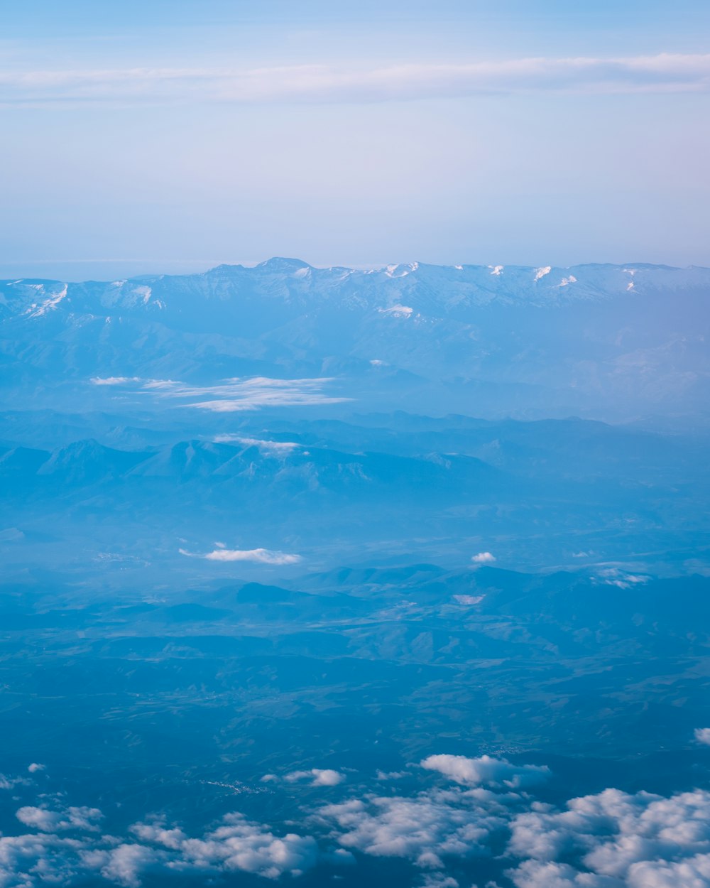 aerial view of snow covered mountains during daytime