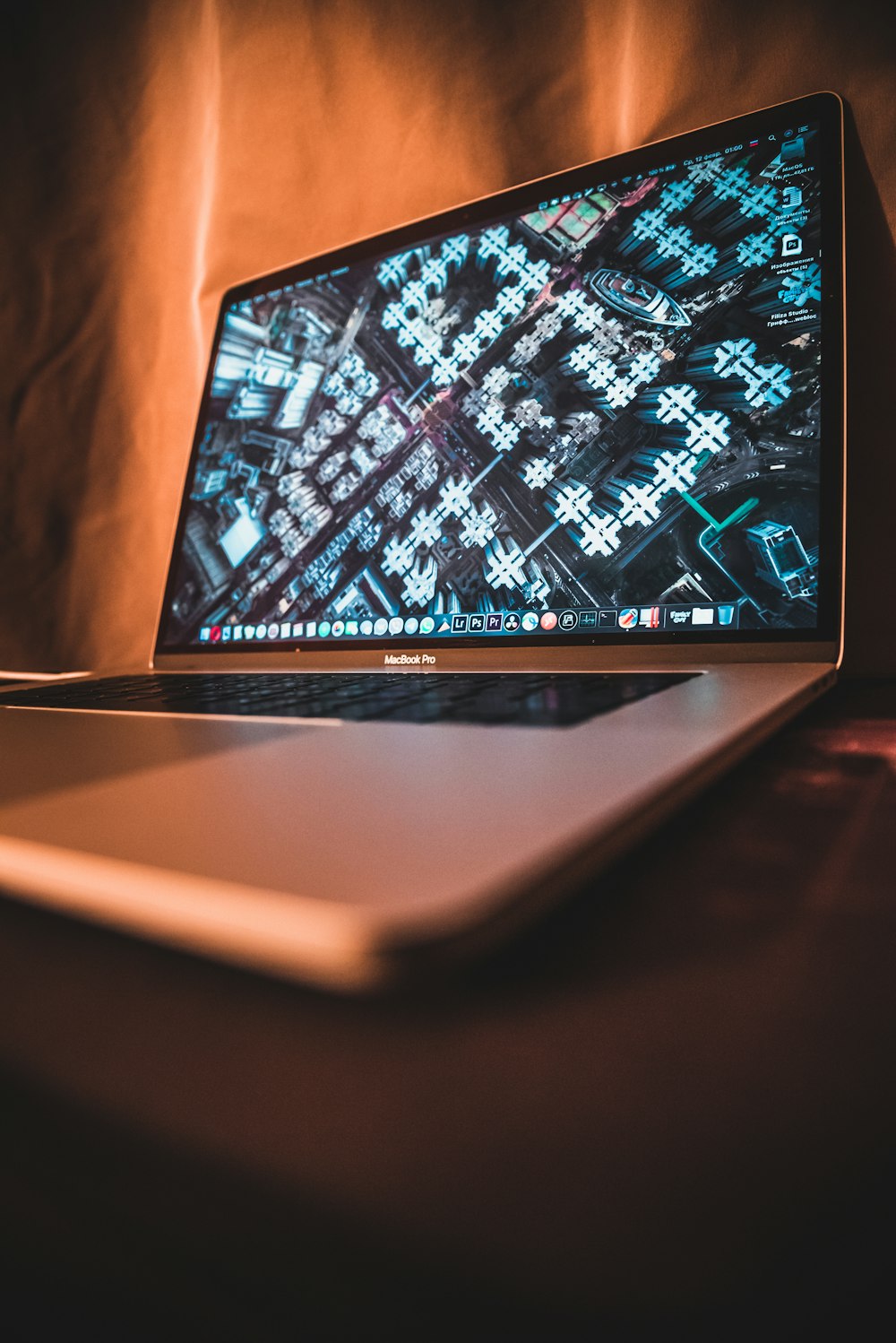 macbook pro on brown wooden table