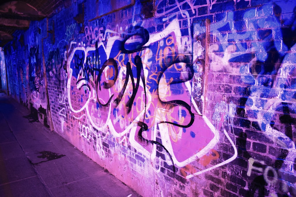 blue and white graffiti on wall