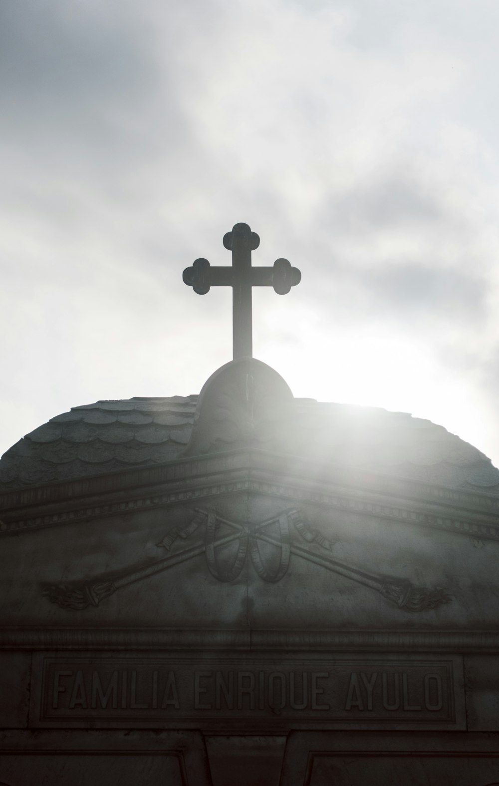 white cross on top of building