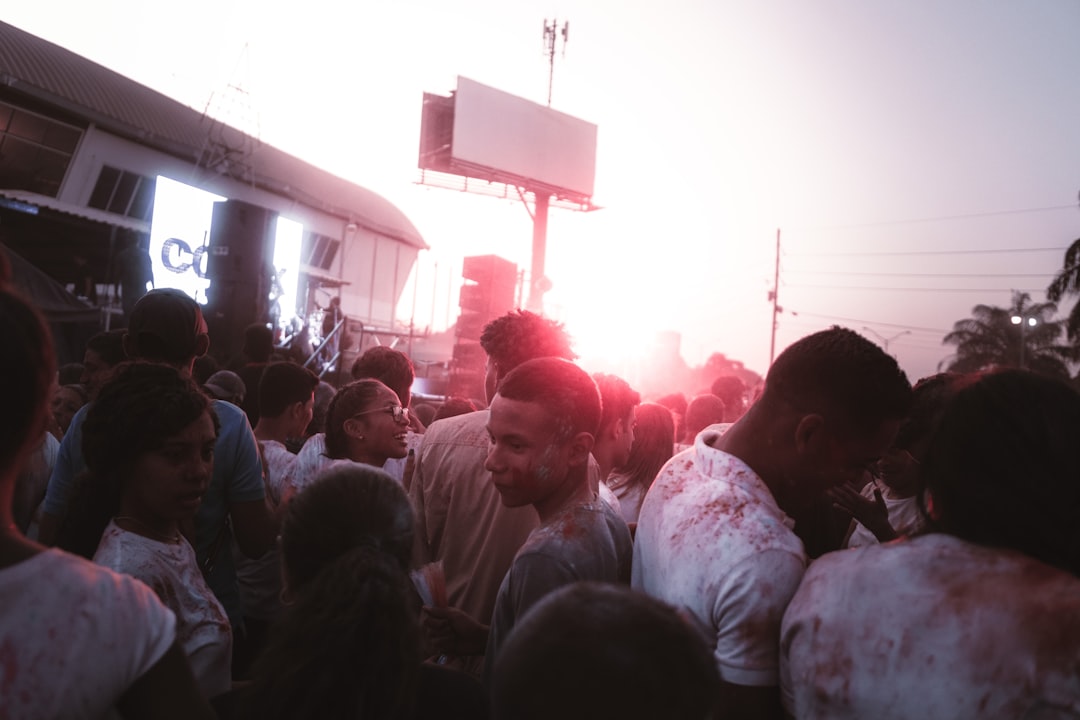 people gathering in a concert during night time