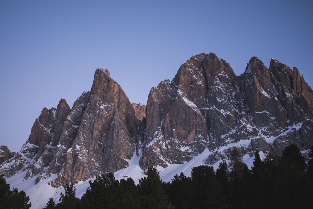 brown rocky mountain under blue sky during daytime