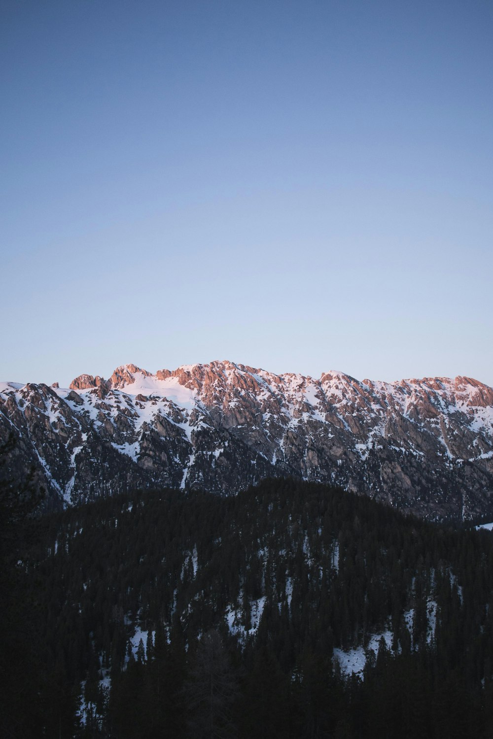 snow covered mountain during daytime