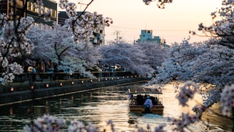 people riding on boat on river during daytime