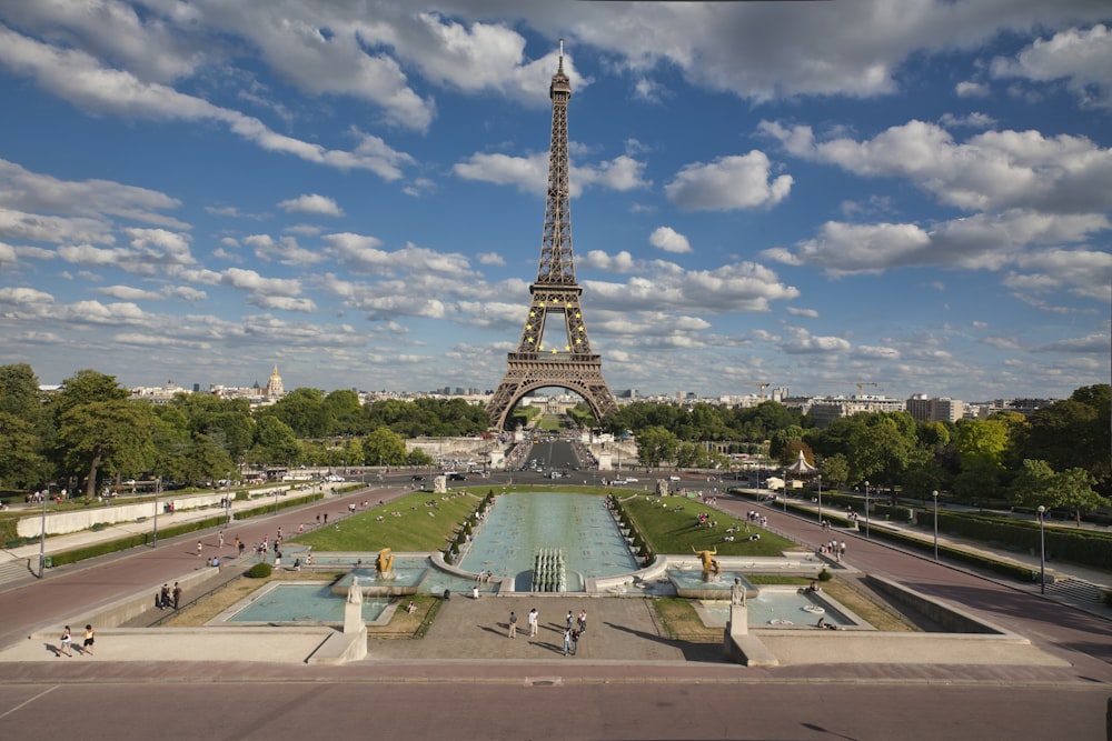 eiffel tower under blue sky and white clouds during daytime