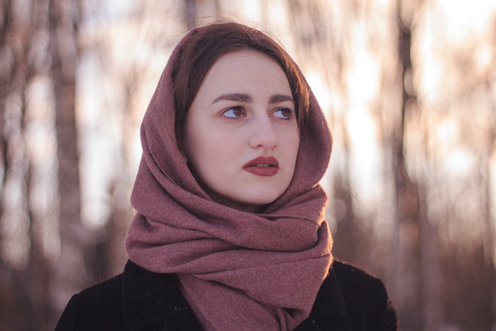 woman in brown hijab and black long sleeve shirt