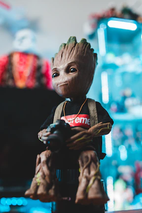 A vibrant 3D printed figurine of a cosplayer in full costume at a lively festival.