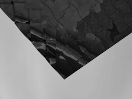 Artistic overhead view of geometric tile patterns blending shades of grey and white.