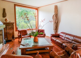 a living room filled with furniture and a fire place