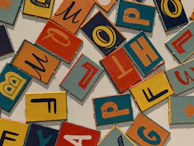 A variety of custom printed tiles and decals laid out on a black background.