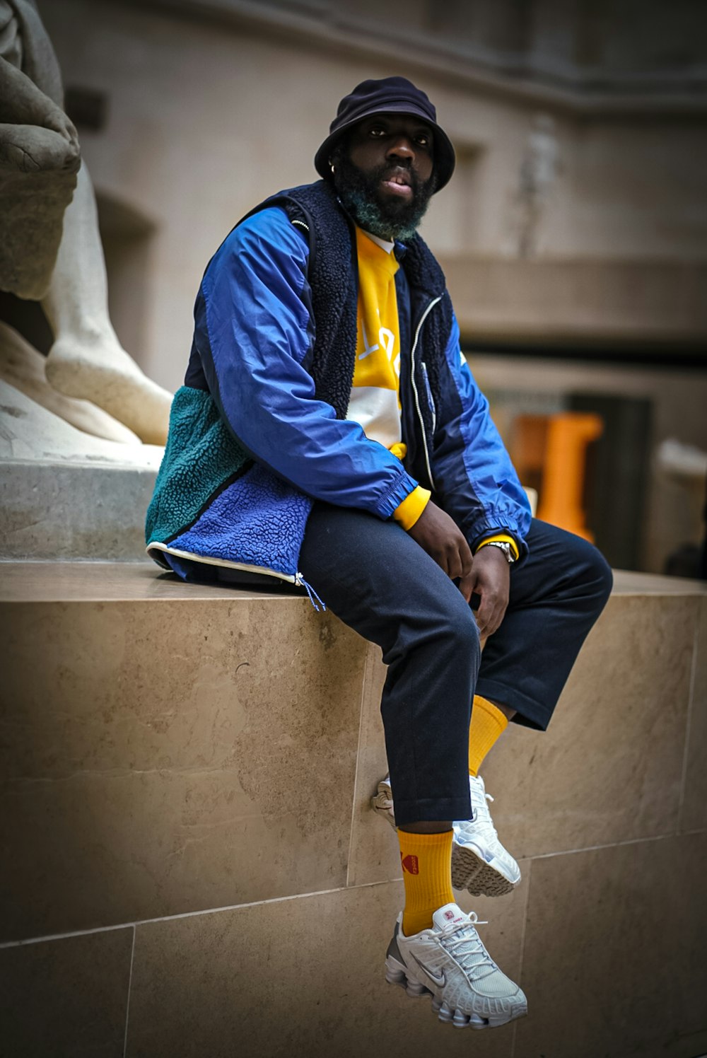 man in blue blazer and blue pants sitting on concrete bench photo – Free  Paris Image on Unsplash