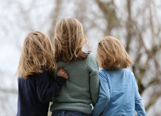 2 women in blue and gray sweaters