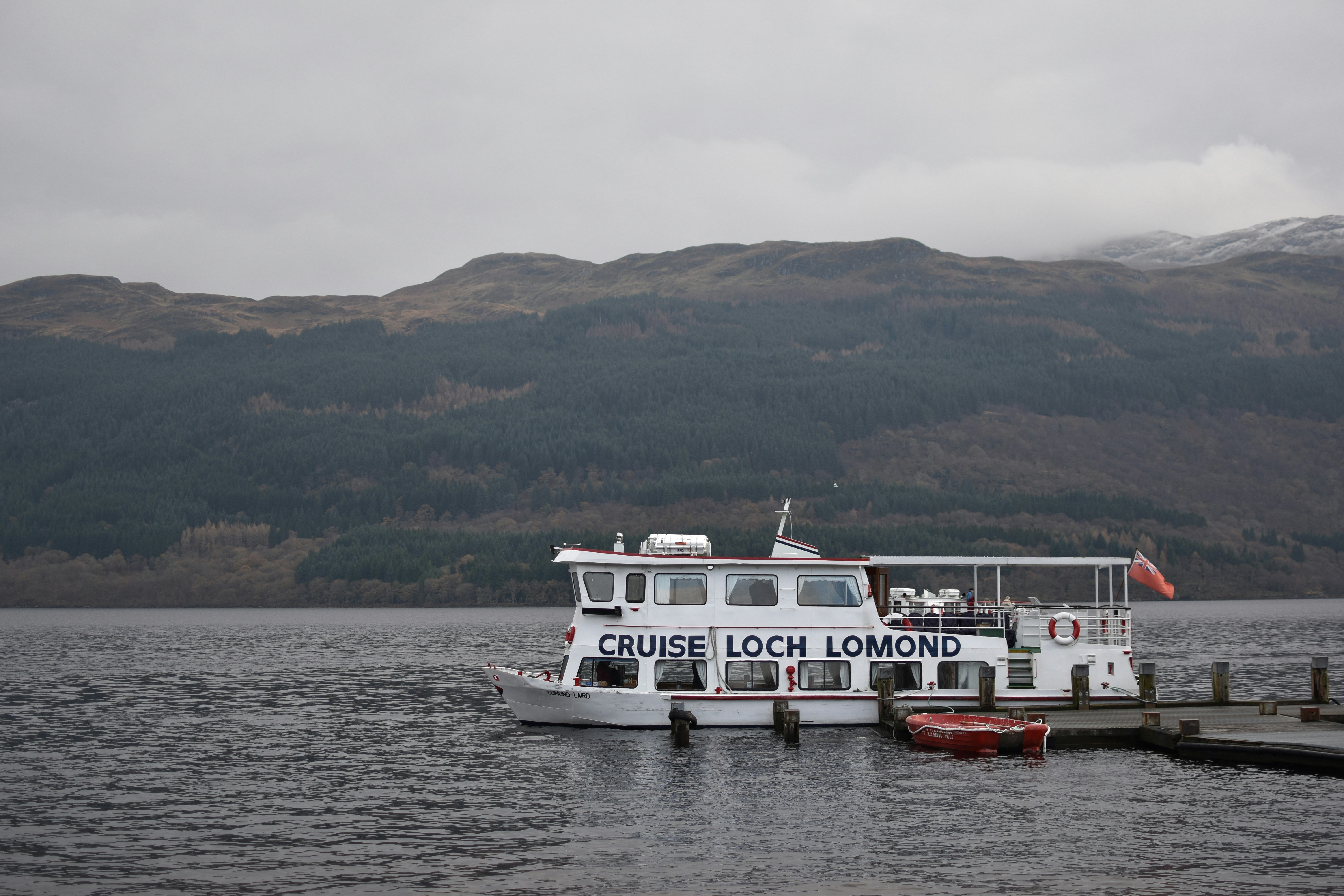 white and red boat on sea during daytime