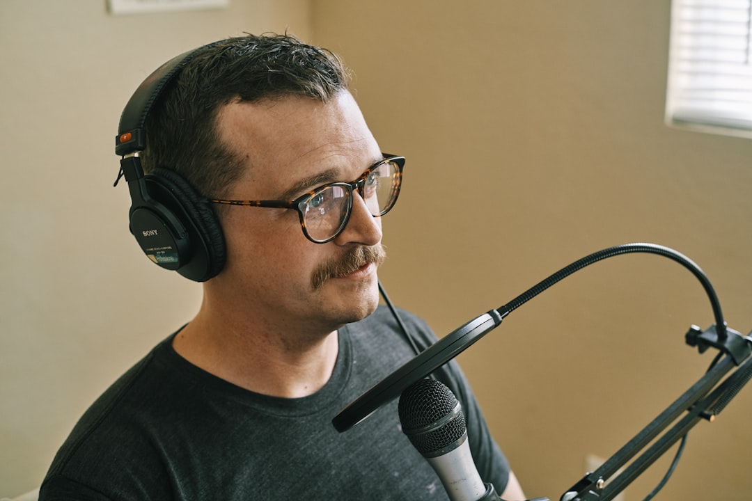 man in black crew neck shirt wearing black headphones, It