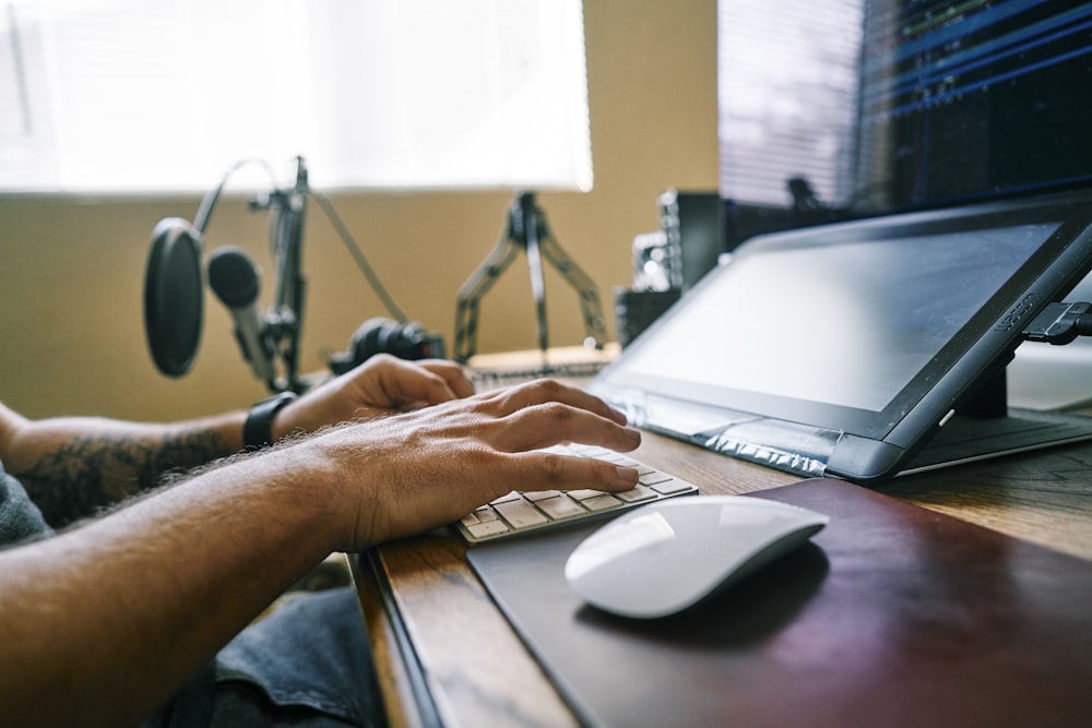 person using gray laptop computer