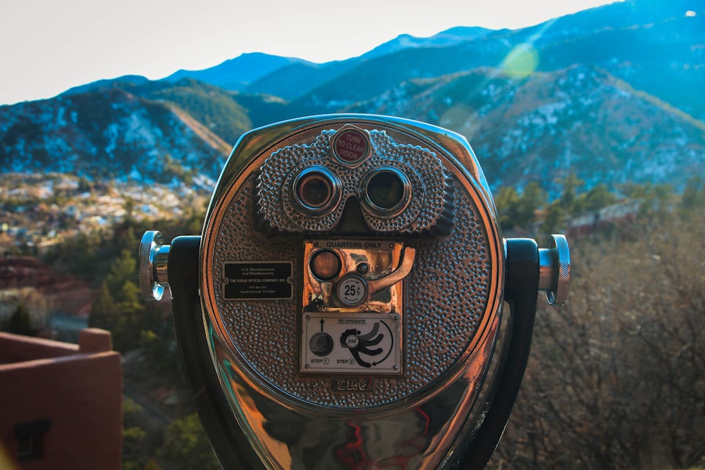 gray and black coin operated binoculars