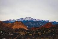 brown and green mountains under white sky during daytime