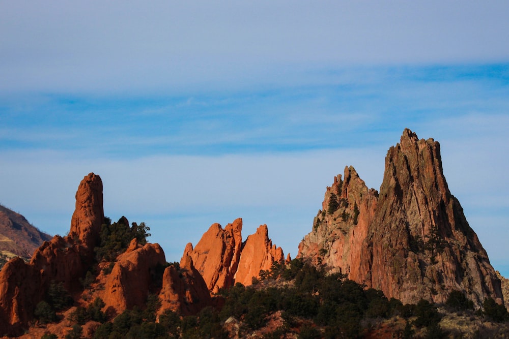 brown rocky mountain under blue sky during daytime