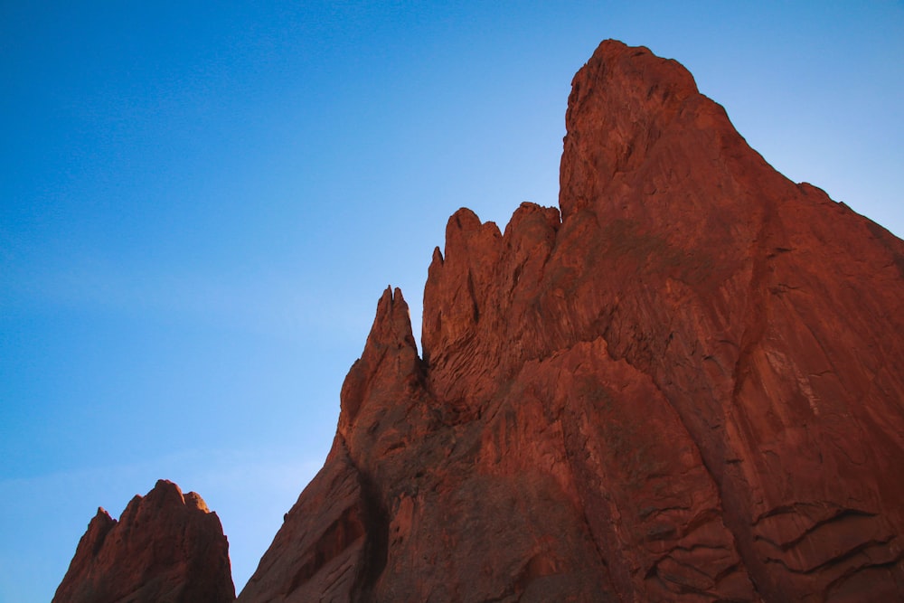 brown rock formation under blue sky during daytime