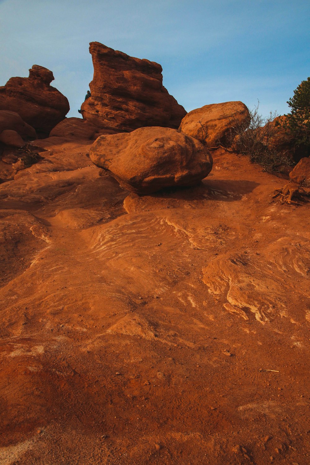 brown rock formation near body of water during daytime