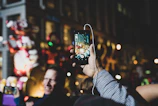 Evening scene of a lively street dance party with headphones glowing under city lights