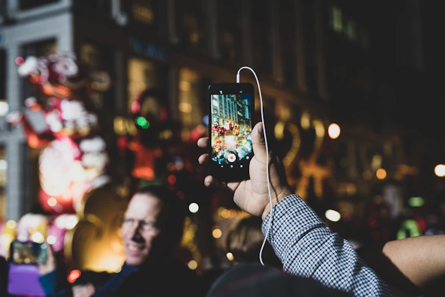 Evening scene of a lively street dance party with headphones glowing under city lights