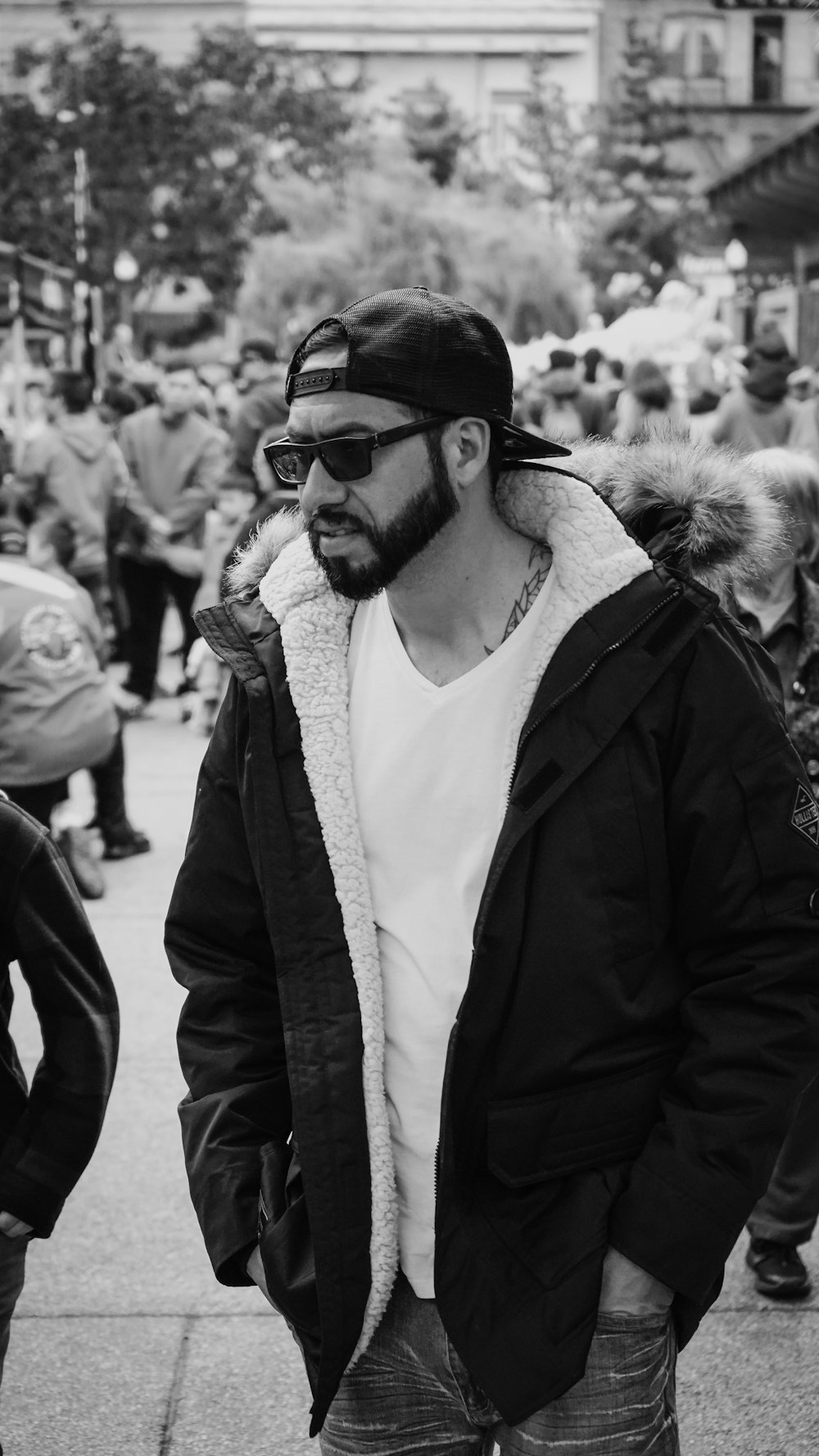 man in black jacket and white shirt