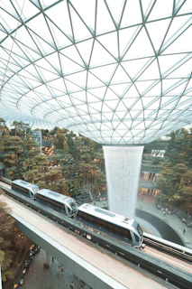 white and black train on track during daytime