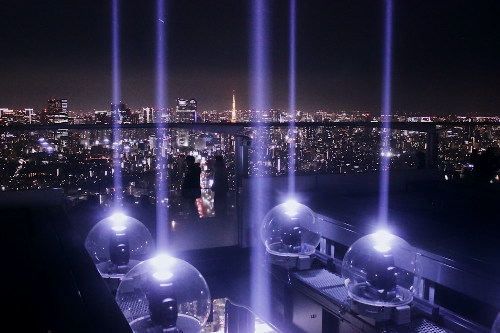 people standing on white building during nighttime