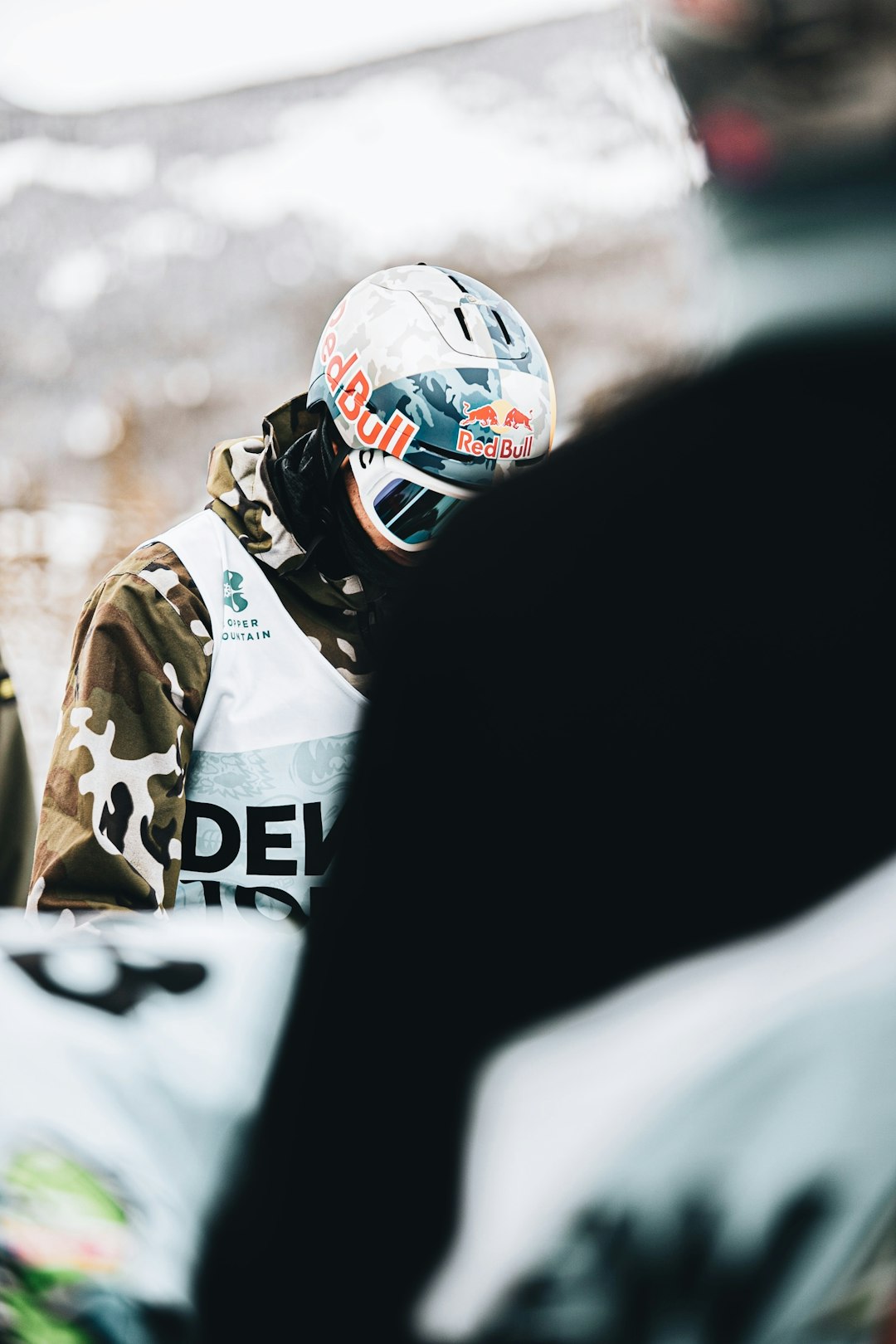 man in white and brown camouflage jacket wearing white helmet