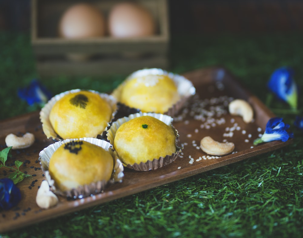 3 cupcakes on green tray