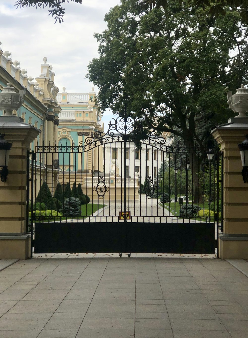 a large gate with a clock on top of it