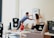 A family happily unpacking boxes in their new home.