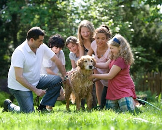 group of people standing on green grass field during daytime