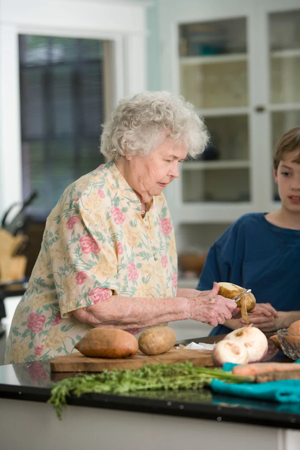 A caregiver bringing a home-cooked meal on a wooden tray