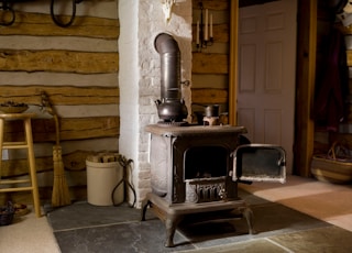 black and silver kettle on black and white stove