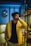 man in yellow jacket standing near glass window