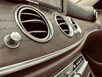 A close-up of car accessories displayed on a wooden table.