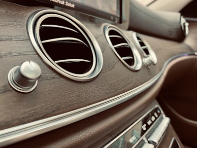 A close-up of car accessories displayed on a wooden table.