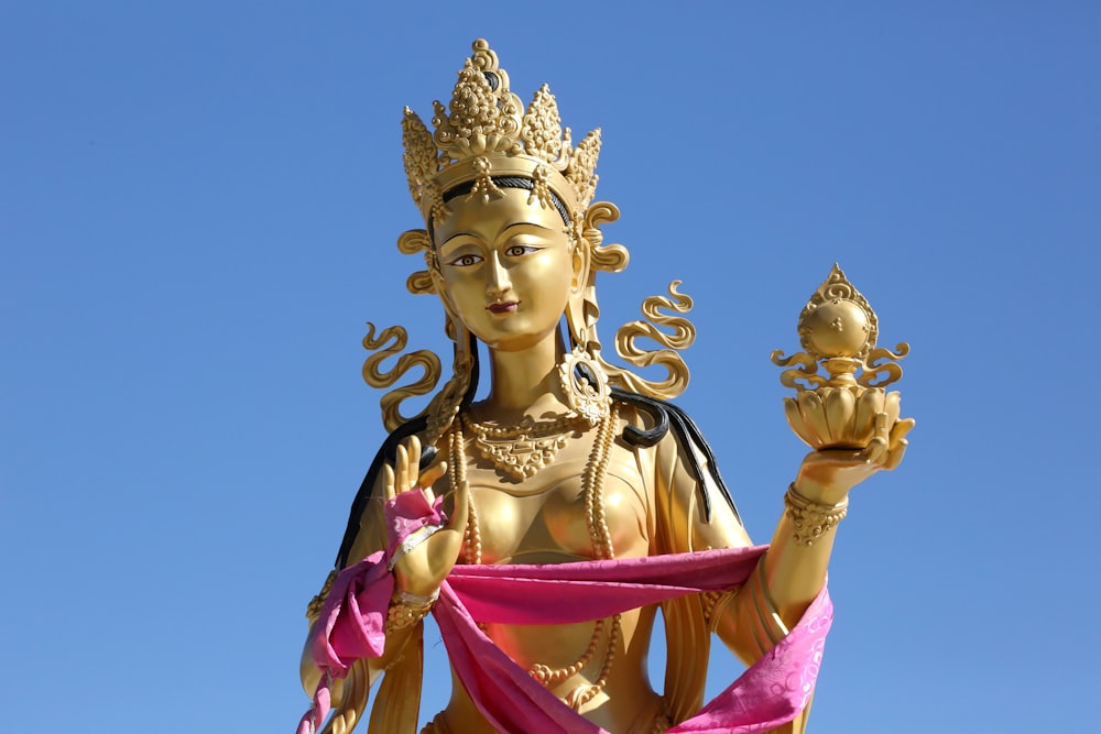 gold and purple hindu deity statue